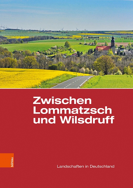 Buchcover mit der Aufschrift "Zwischen Lommatzsch und Wilsdruff". Im oberen Bildrand sieht man eine Landschaft mit Feldern, Straßen, enem kleinem Ort, Bäumen, Windrädern und Kirchturm